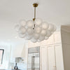 Dainolite Miles 8 Light Chandelier Aged Brass Frosted White Glass Lamp|Lustre Miles de Dainolite en verre blanc givré, avec fini laiton vieilli et 8 ampoules