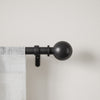 Umbra Bolas Matte Black Expandable 1" Curtain Rod - 36"-72" | Tringle à rideaux extensible Bolas de Umbra noir mat de 1 po - 36 po à 72 po