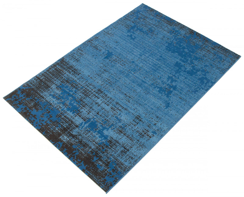Janaki Blue 6'7\" x 9'6\" Area Rug